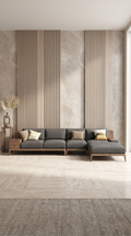 Maison Arbor Isola Sectional: A modern L-shaped luxury sofa in charcoal grey fabric with a walnut wood base, centered in a minimalist living room with marble wall panels and cinematic natural lighting.